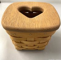 Top view of the basket showing wooden lid with heart-shaped cutout.