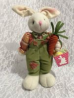 Front full view of 14-inch standing Easter bunny plush with weighted feet on lace background