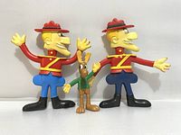 Three vintage figures: two bendable Dudley Do-Right and one standing Bullwinkle figure, showing overall condition and size