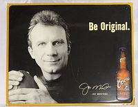 Front view of the metal sign featuring Joe Montana holding a football, Coors beer bottle graphic, signature, and slogan 'Be Original.'
