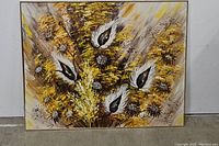 Front view of large vintage floral painting with dominant yellow and brown colors and black and white accents.