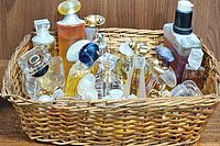 Basket displaying mixed assortment of miniature perfume bottles