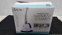 Closed original box for SALAV Performance Series Garment Steamer showing product image and features.