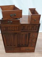 Top perspective of the antique cabinet section with extra drawers visible on top.