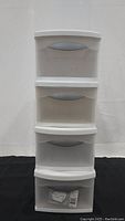 Four Sterlite ClearView stackable storage drawers stacked vertically, showing white frame and clear front drawers.