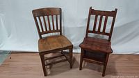 Two wooden chairs side by side: vintage oak slat back and mahogany library step chair.