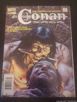 Front cover image of Conan Saga Marvel comic issue 77, August, showing detailed artwork of Conan holding a severed head.