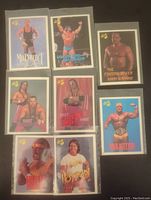 Top-down view showing all eight wrestling cards arranged in two columns. Cards include Mr. Perfect, Ultimate Warrior, Barry Windham, Bret Hart, Hart Foundation duo, Hulk Hogan, and others.