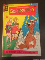 Front cover showing Scooby-Doo and the gang with a snowy and stormy background and lightning bolts.