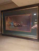 Framed print showing Spitfire aircraft in flight with a propeller motion effect.