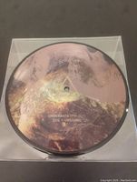 Picture disc vinyl record side B with label 'UNDEROATH 1999-2013 SIDE B UNSOUND'