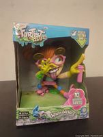 Front view of Windy Wendy toy in its original retail box with colorful branding and sound feature highlights.