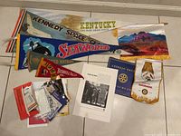 Full overview of the assorted vintage pennants, Rotary mementos, old Bell Telephone ad, vintage photos and ephemera.