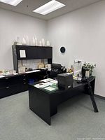 L-shaped desk suite showing main desk, overhead cabinet and return section