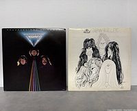 Front cover of Triumph 'Progression of Power' album and Aerosmith 'Draw the Line' album showing minor wear on covers