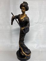 Front view of the Asian lady figurine showing detailed kimono and face.