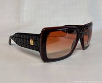 Front three-quarter view showing frame shape, color and lens gradient