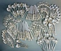 Overview of all flatware pieces laid out on table