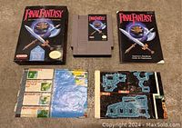 Box, cartridge, manual, and maps laid out on floor