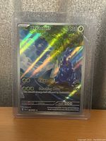 Photo of one holographic Heracross Pokemon card in protective sleeve.
