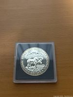 Reverse side of the coin featuring a moose and landscape with Parks Canada commemorative text.