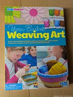 Front of the box showing title, product photos, children's images, and colorful yarn basket project