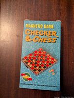 Front of original box showing 'MAGNETIC GAME CHECKER & CHESS' with an image of the board and pieces