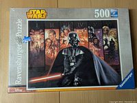Front view of the Ravensburger 500 Star Wars puzzle box showing the puzzle artwork featuring Darth Vader and other Star Wars characters.
