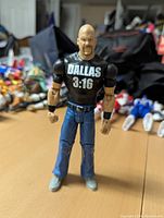Stone Cold Steve Austin Mattel WWE 5 inch figure posed on table with good lighting showing front and apparel details.