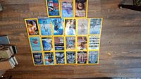 Overview of 18 National Geographic magazines laid out on the floor showing their front covers with the iconic yellow border