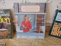 Book titled 'Good Things for Organizing' featuring a woman holding an object on cover