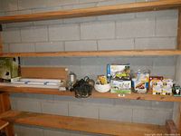 Wide view showing shelves with various lighting boxes, bulbs, and accessories.