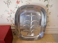 Image showing a Pewtarex metal raised serving tray with embossed design, silver-tone, rectangular with rounded edges.