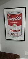 Full view of framed Campbell's Soup print hanging on wall