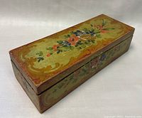 Rectangular wooden box with hand painted floral design on top and sides, showing vintage colors and minor wear.