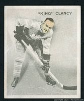 Front of card showing Clancy in Maple Leafs uniform leaning on stick