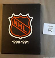 Black custom binder with large NHL logo and text 1990-1991 on cover