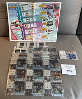 Binder pages showing 40 hockey cards including 10 Game Film cards and a 5x7 Wayne Gretzky card along with promotional items and maxsold lot label.