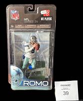 Front view of Tony Romo McFarlane figurine sealed in plastic packaging with visible NFL and NFL Players logos.