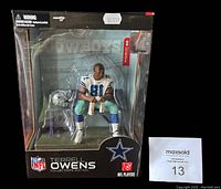 Sealed McFarlane box showing the Terrell Owens figurine with Dallas Cowboys branding and retail price sticker.