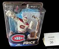 Front view of the closed packaging showing Carey Price figurine in white Montreal Canadiens jersey with mask and glove.