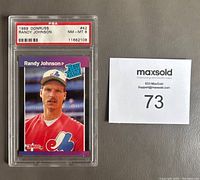 Front view of 1989 Donruss Randy Johnson rookie card, graded NM-MT 8 by PSA in protective case.