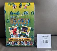 Front view of sealed 1992-93 OPC Premier Hockey wax box, showing branding and sample card images.