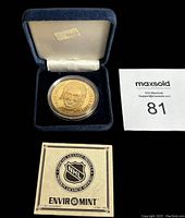 Bronze medallion displayed inside open blue velvet case with white satin lid interior and original $59.95 price tag. Medallion features Wayne Gretzky portrait and Enviromint branding with NHL licensed product authenticity card.