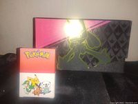 Two Pokemon RPG themed deck boxes, one black and pink with Greninja design and one red and white with Pikachu and starter Pokemon art.