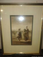 Full view of framed watercolor painting showing the Dutch scene with two figures walking, signed by artist in bottom left corner.