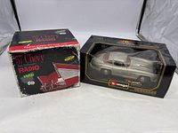 Photo showing the '57 Chevy High Performance Radio box and the Mercedes Benz 500K Roadster model car in its original packaging.