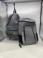 Two Philadelphia Eagles backpacks displayed side by side showing the front and top views.