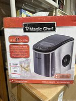 Front view of boxed Magic Chef countertop ice maker showing 27 lbs per day capacity and model information