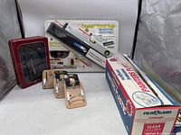 Full view of laser tool kit, 3 steel hammer holders, painter's plastic box, and FlexiDriver container